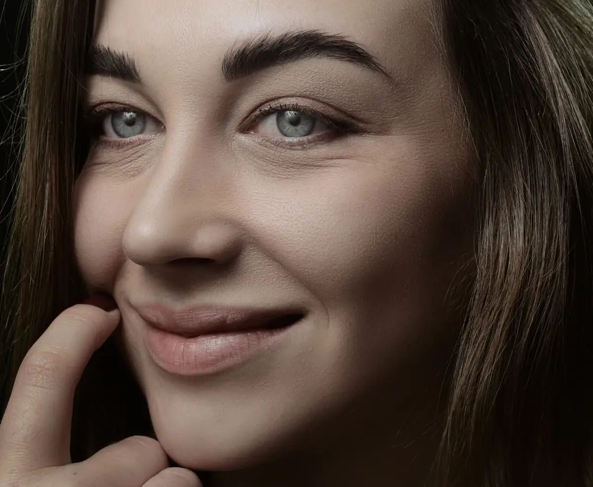 Visible fine lines around the eyes and mouth
